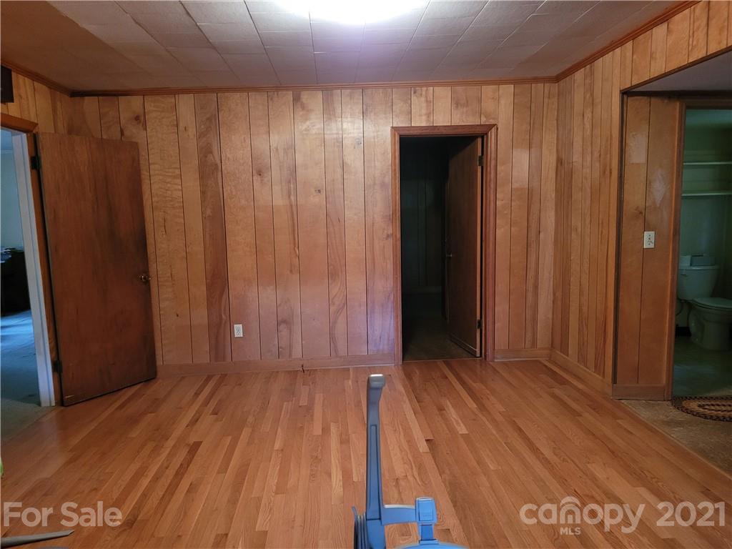 511 Flynn Road Rutherfordton, NC 28139 - Photo 10 of 32 a view of a room with wooden floor and closet