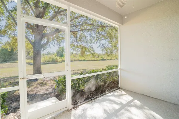 a room with gym equipment and a window