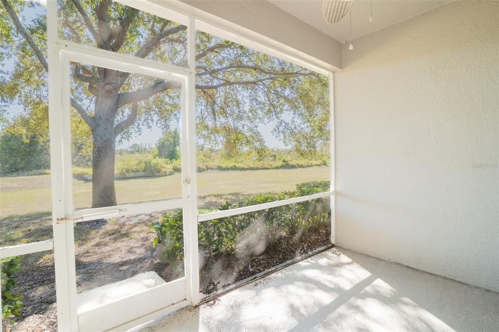 2739 Rutledge Court Winter Haven, FL 33884 - Photo 13 of 24 a view of a glass door with a tree