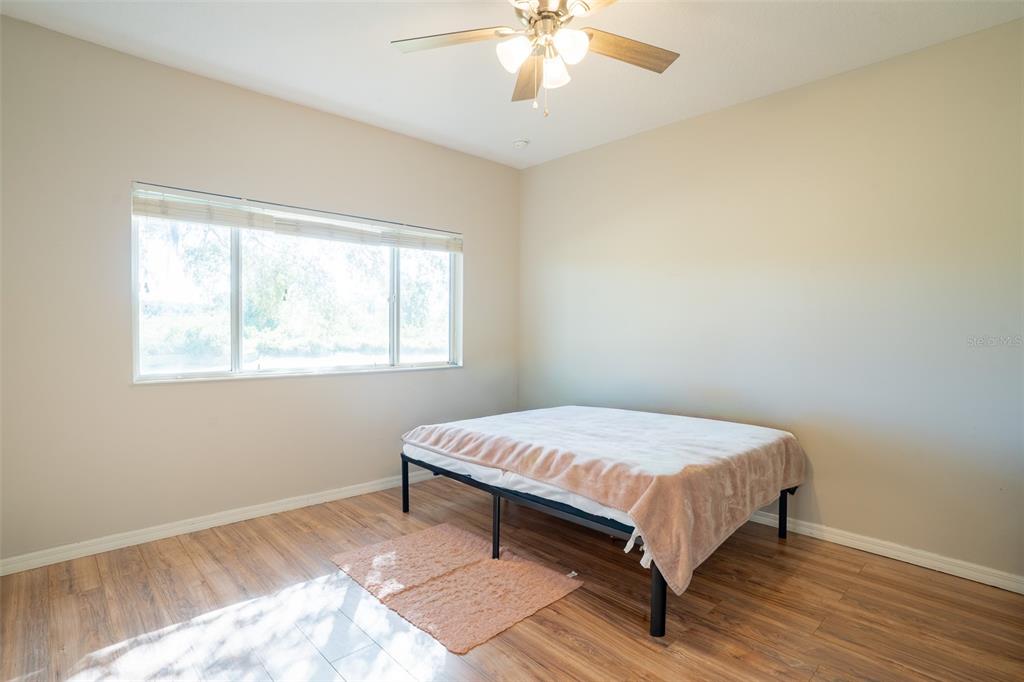 2739 Rutledge Court Winter Haven, FL 33884 - Photo 10 of 24 a bedroom with a bed and window