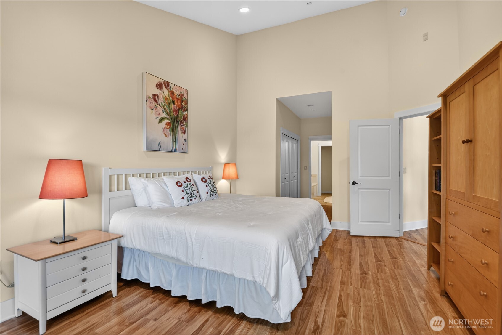 383 Romance Hill Road, Unit C Belfair, WA 98528 - Photo 11 of 25 a bedroom with a bed and a lamp
