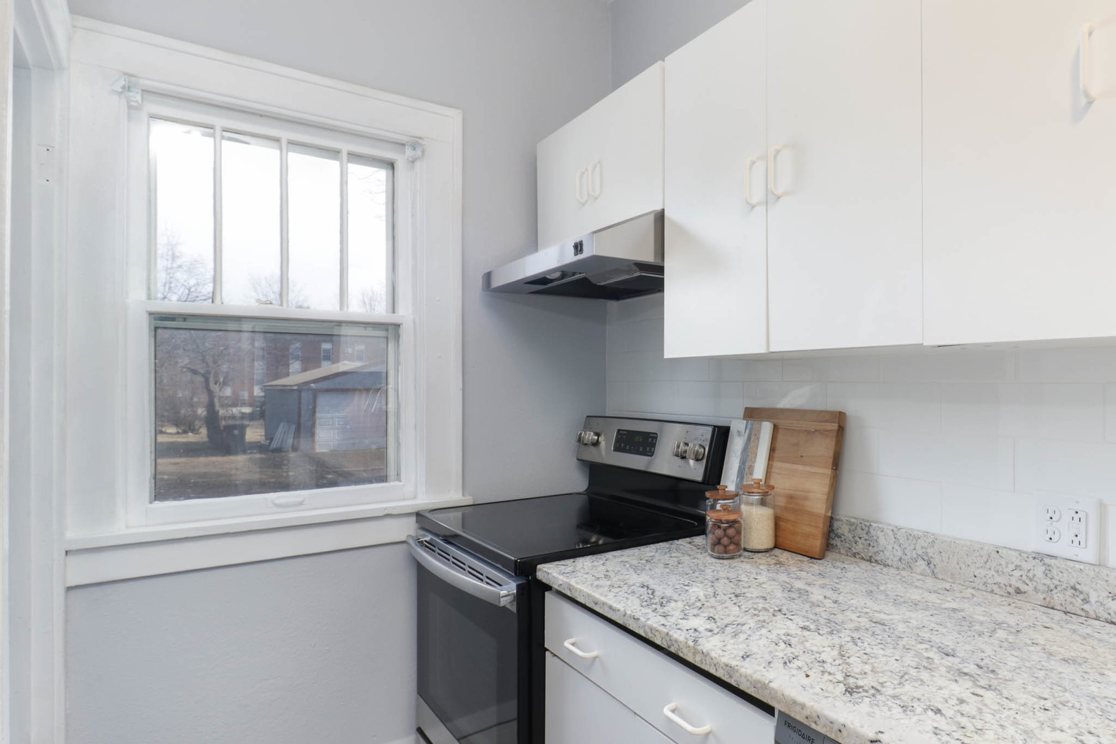 508 North School Street Normal, IL 61761 - Photo 13 of 38 a kitchen with stainless steel appliances granite countertop a sink stove and cabinets
