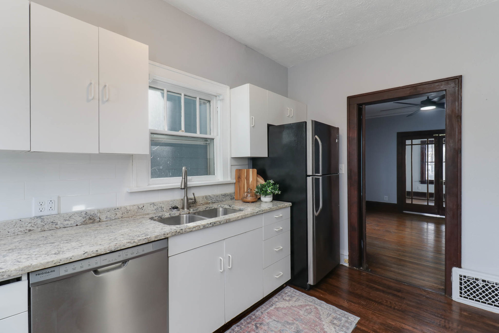 508 North School Street Normal, IL 61761 - Photo 15 of 38 a kitchen with a sink and a refrigerator