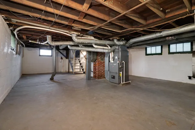 a view of empty room with wooden ceiling