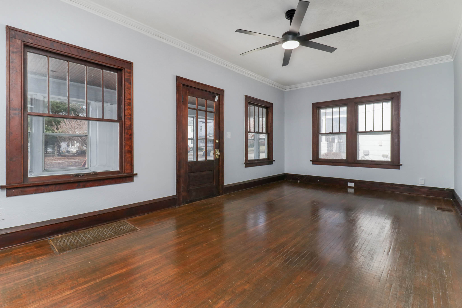 508 North School Street Normal, IL 61761 - Photo 7 of 38 a view of an empty room with wooden floor and a window