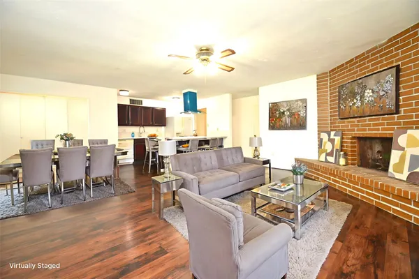a living room with fireplace furniture and a flat screen tv