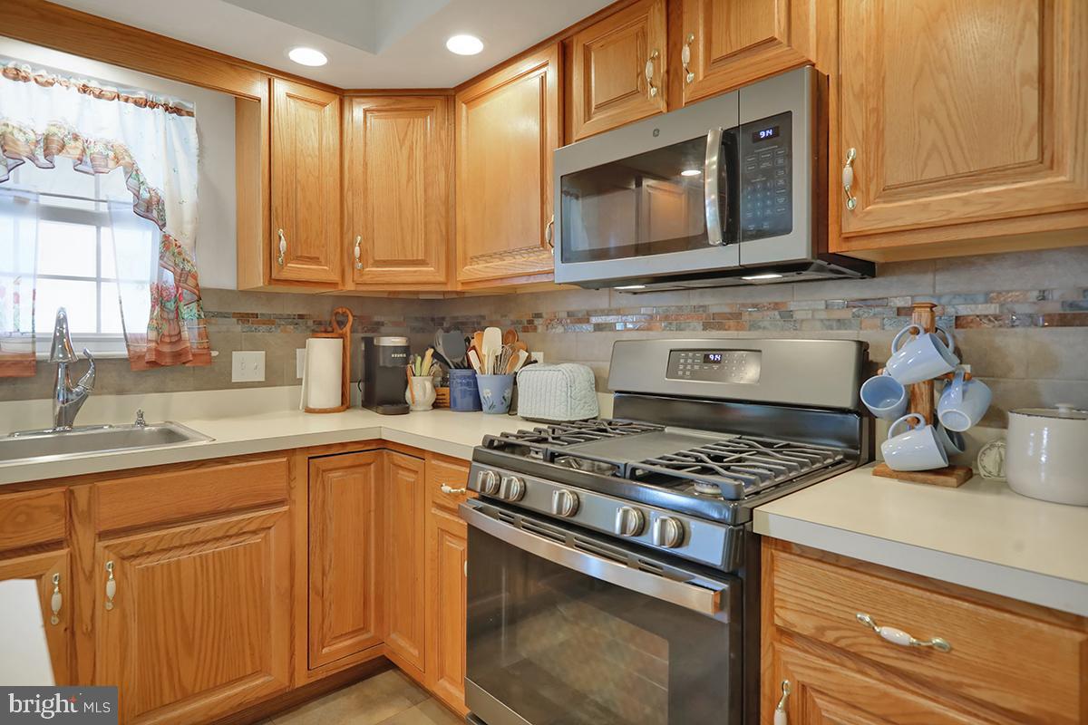 103 Eagles Lane Reading, PA 19608 - Photo 11 of 42 a kitchen with granite countertop cabinets stainless steel appliances and a sink