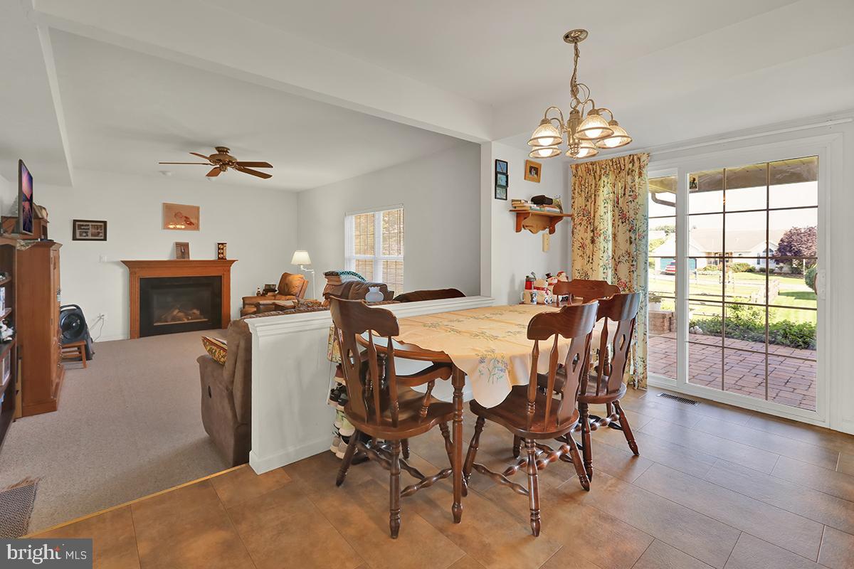 103 Eagles Lane Reading, PA 19608 - Photo 14 of 42 a view of a dining room with furniture window and wooden floor