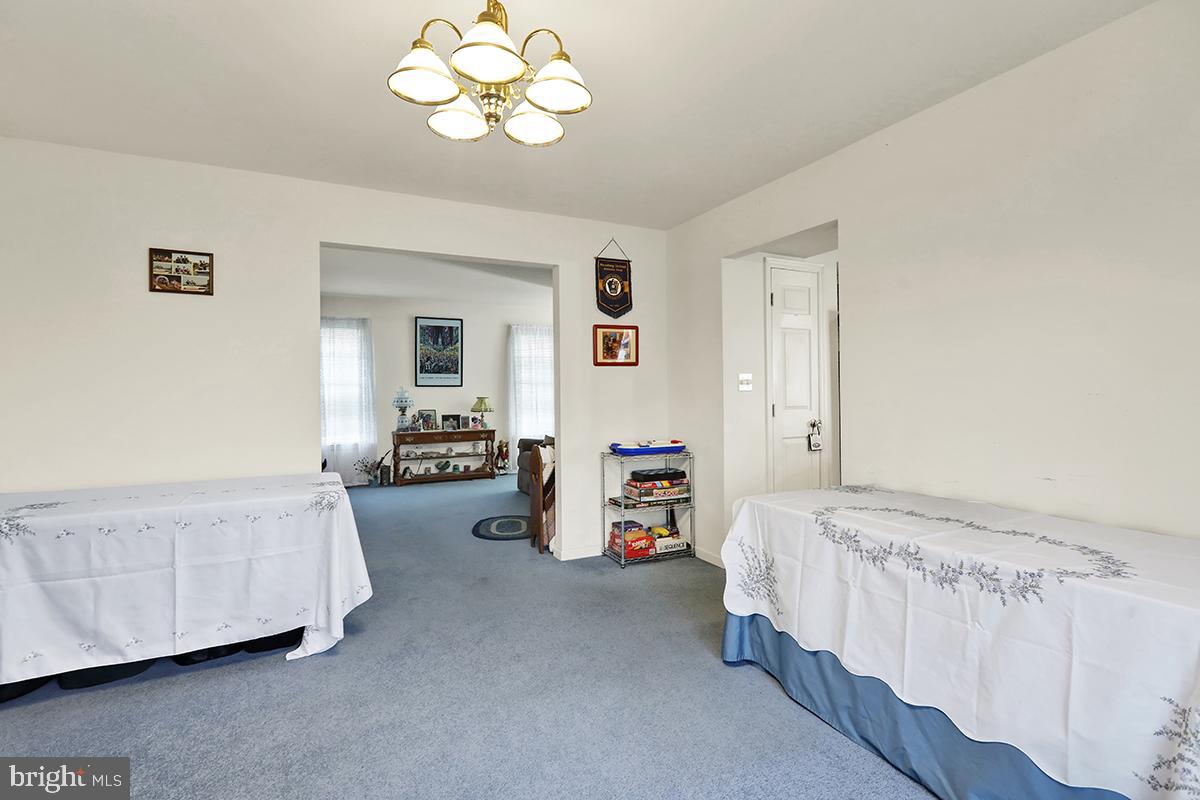 103 Eagles Lane Reading, PA 19608 - Photo 21 of 42 a bedroom with furniture and a chandelier