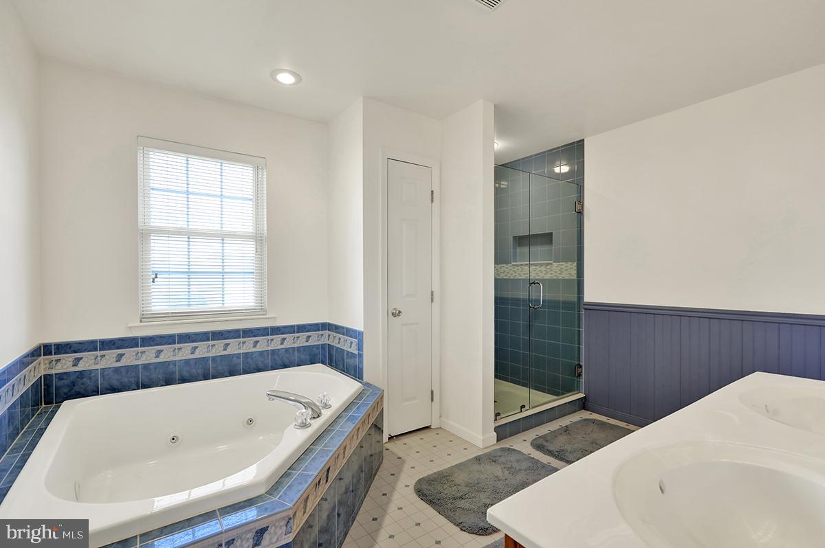 103 Eagles Lane Reading, PA 19608 - Photo 28 of 42 a bathroom with a bathtub and shower