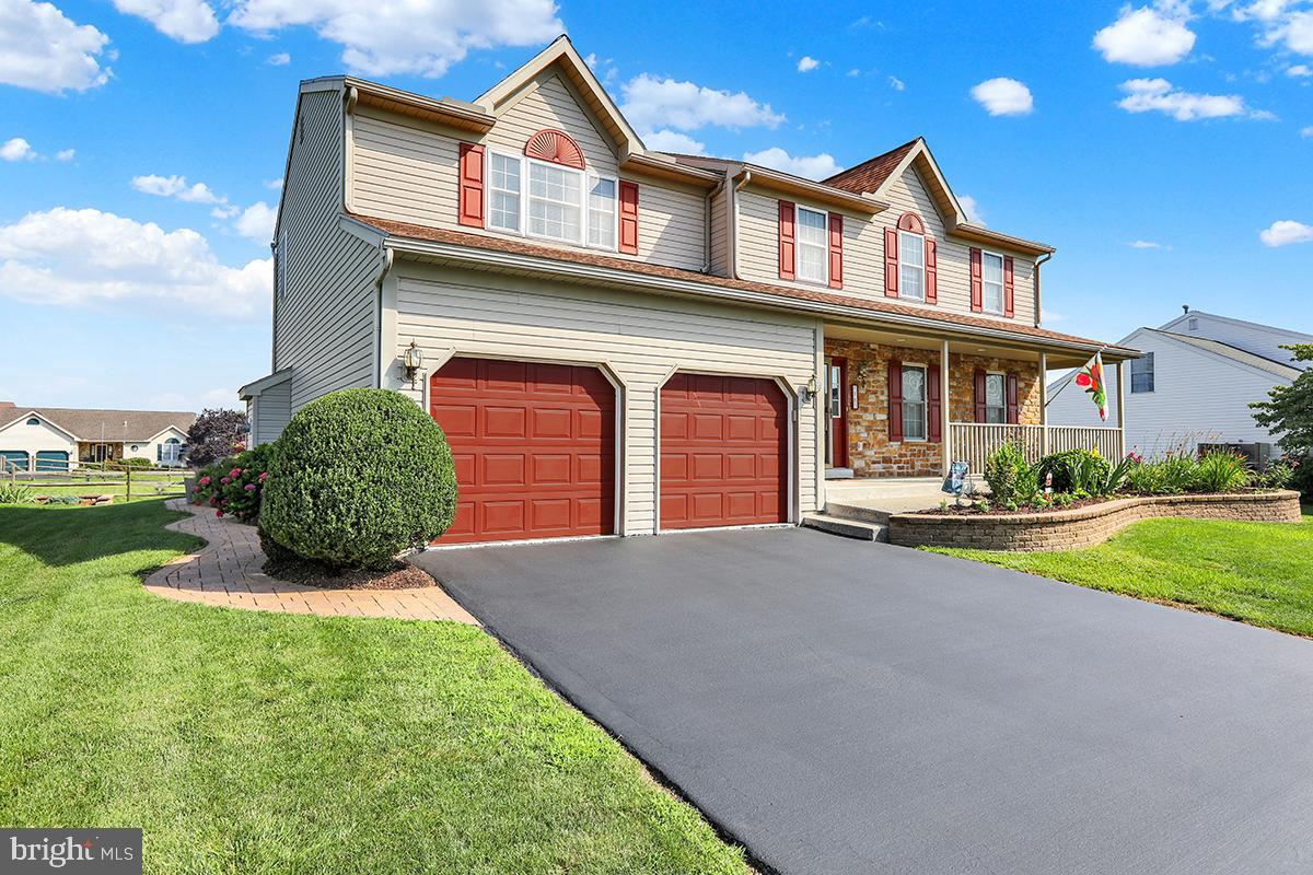103 Eagles Lane Reading, PA 19608 - Photo 3 of 42 a front view of a house with garden