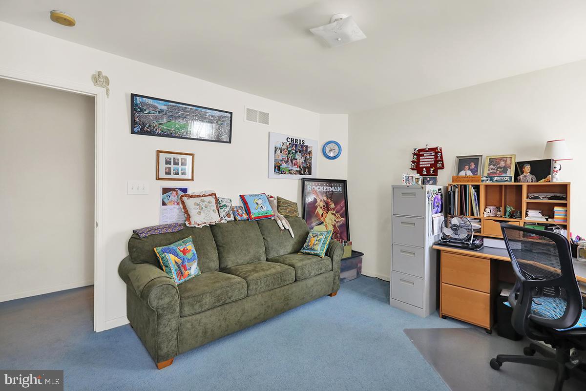 103 Eagles Lane Reading, PA 19608 - Photo 35 of 42 a living room with furniture and a bookshelf