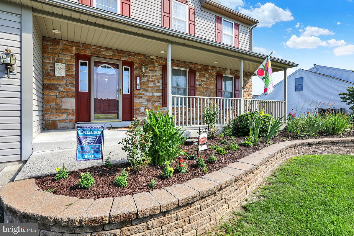 103 Eagles Lane Reading, PA 19608 - Photo 4 of 42 a view of a brick building with potted plants