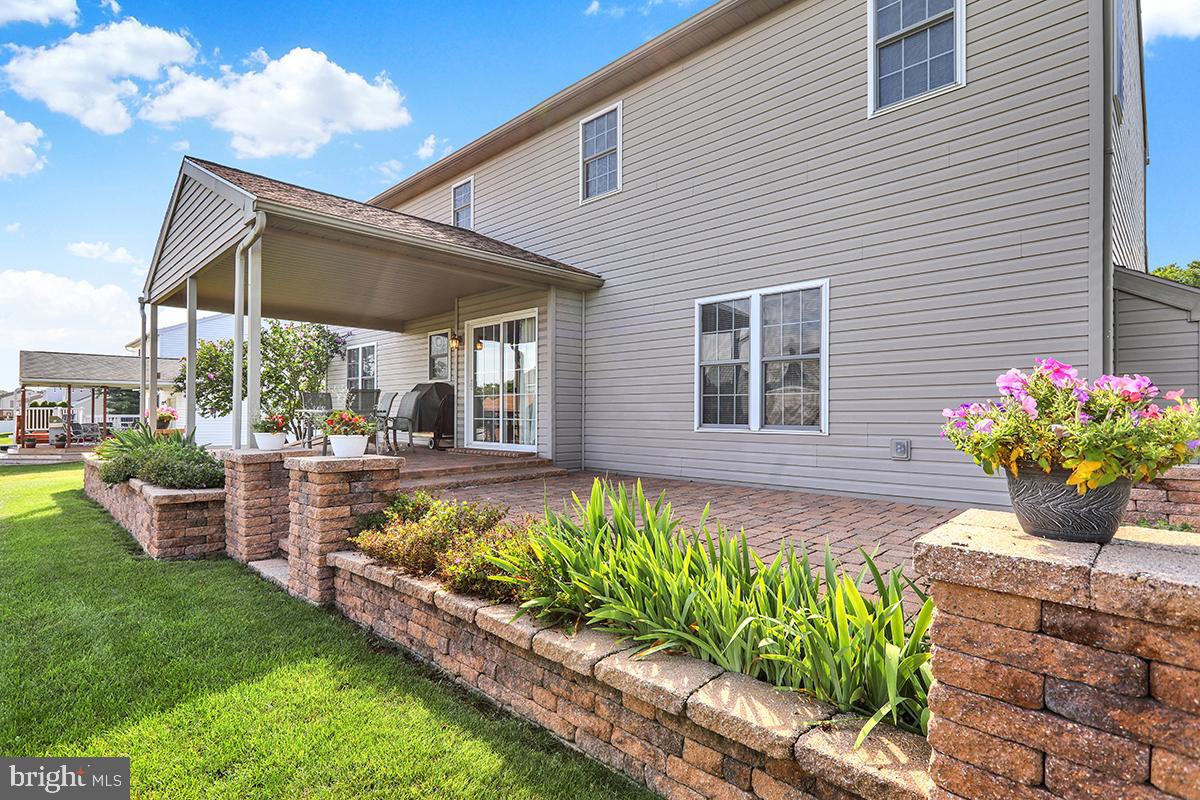 103 Eagles Lane Reading, PA 19608 - Photo 41 of 42 a front view of a house with a garden and patio
