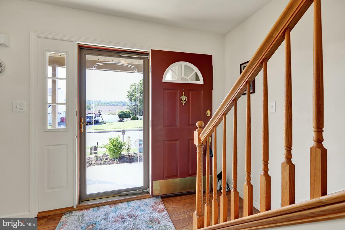 103 Eagles Lane Reading, PA 19608 - Photo 6 of 42 a view of staircase with wooden floor and a window