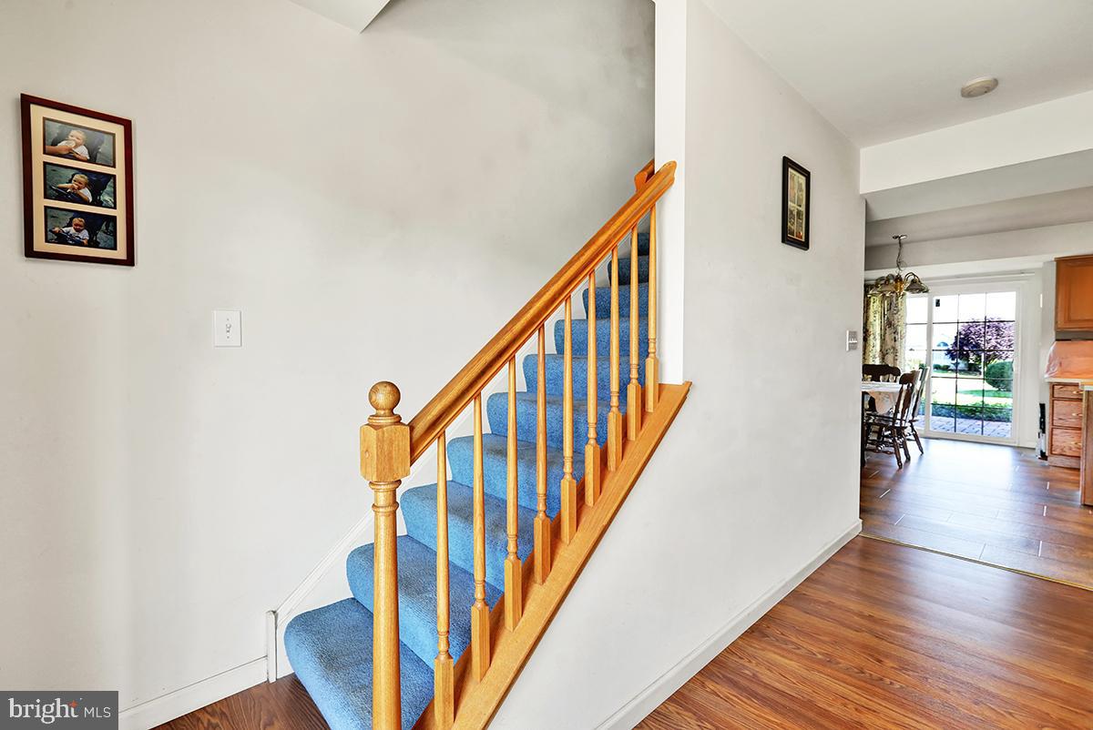 103 Eagles Lane Reading, PA 19608 - Photo 7 of 42 a view of a hallway with wooden floor and stairs