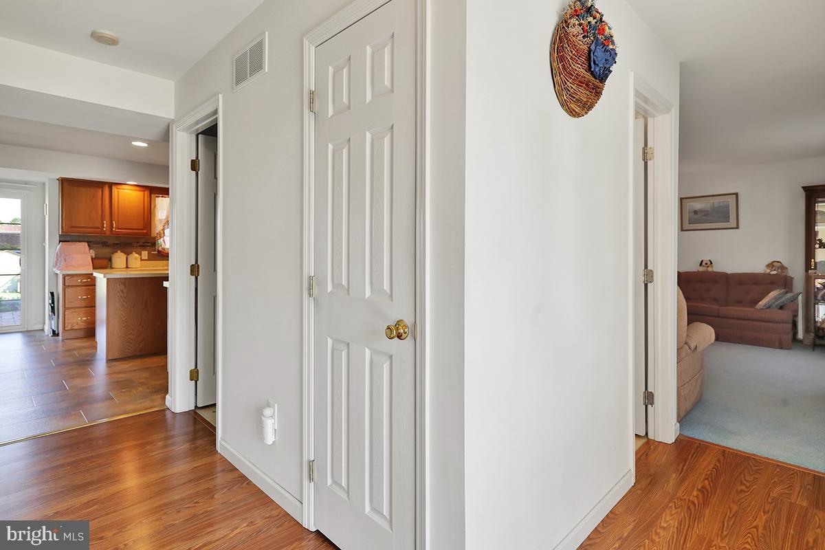 103 Eagles Lane Reading, PA 19608 - Photo 8 of 42 a view of a hallway with wooden floor and workspace