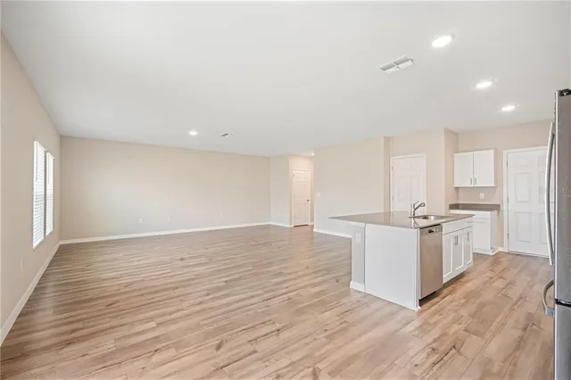 a view of kitchen with wooden floor