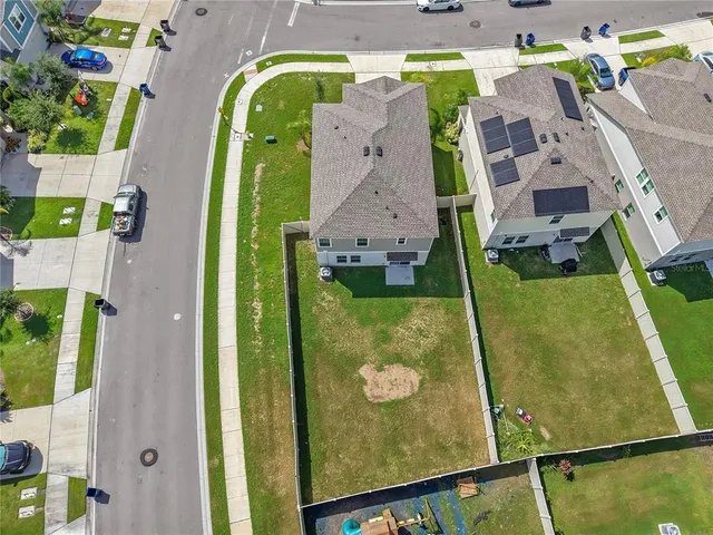 an aerial view of a house with a swimming pool
