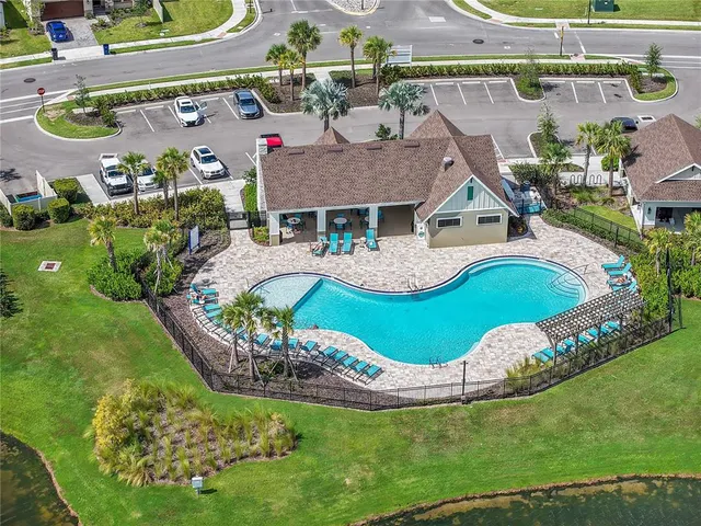 an aerial view of residential houses with outdoor space