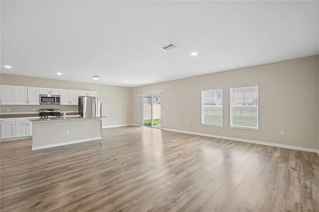 a view of kitchen with window and wooden floor