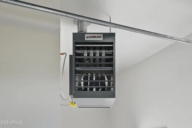 an aerial view of a house with a yard and garden