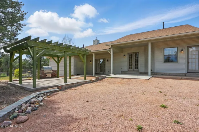 a wooden bench sitting in the middle of a field