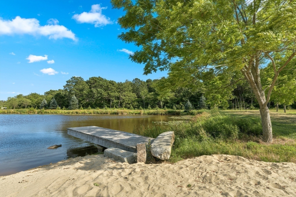 46 Roos Road Sandwich, MA 02537 - Photo 19 of 28 a view of a lake from a yard