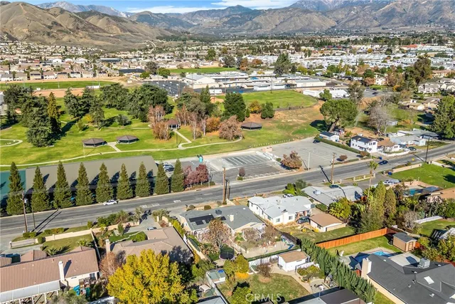 an aerial view of residential houses with outdoor space