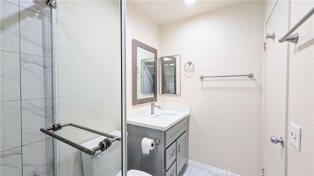 801 South 2nd Street, Unit 3 Alhambra, CA 91801 - Photo 11 of 22 a bathroom with a sink a mirror and shower