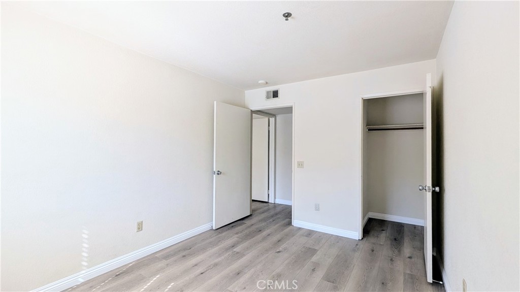 801 South 2nd Street, Unit 3 Alhambra, CA 91801 - Photo 16 of 22 a view of an empty room with wooden floor