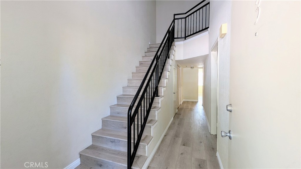 801 South 2nd Street, Unit 3 Alhambra, CA 91801 - Photo 20 of 22 a view of staircase with wooden floor and white walls