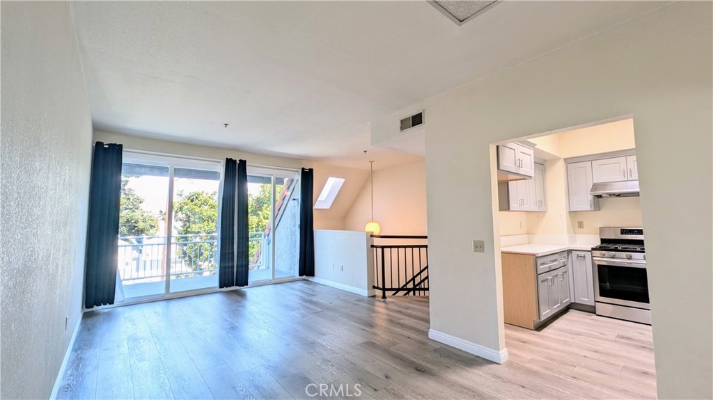 801 South 2nd Street, Unit 3 Alhambra, CA 91801 - Photo 2 of 22 a view of a kitchen with wooden floor and a window