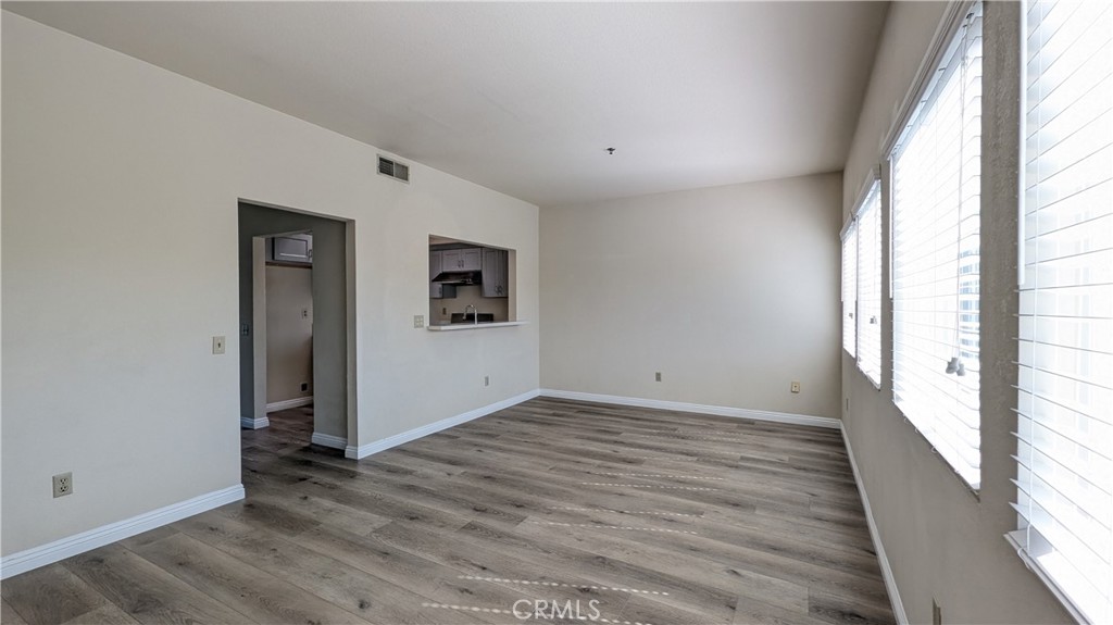 801 South 2nd Street, Unit 3 Alhambra, CA 91801 - Photo 6 of 22 an empty room with wooden floor and windows