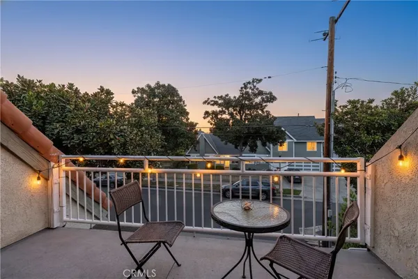 a view of a balcony with chairs