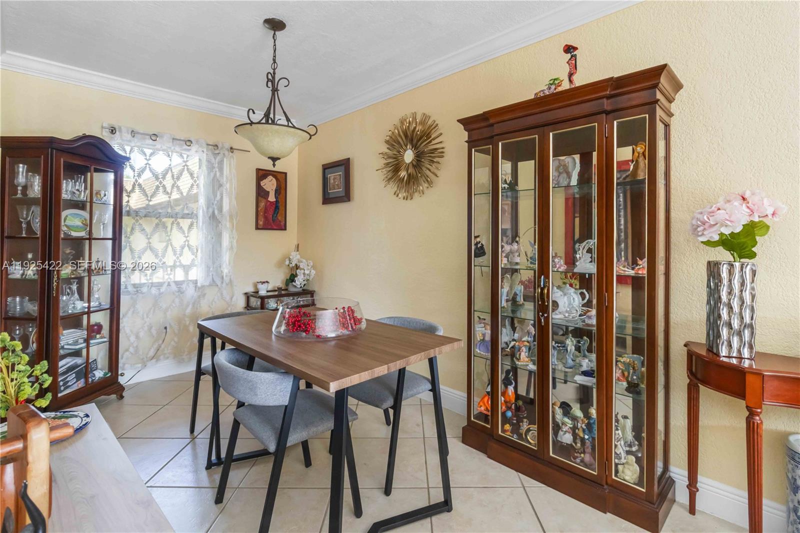 8475 Southwest 94th Street, Unit 217E Miami, FL 33156 - Photo 11 of 21 a dining room with furniture and window