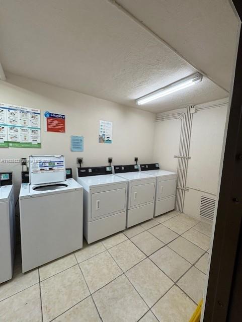 8475 Southwest 94th Street, Unit 217E Miami, FL 33156 - Photo 20 of 21 a utility room with cabinets washer and dryer