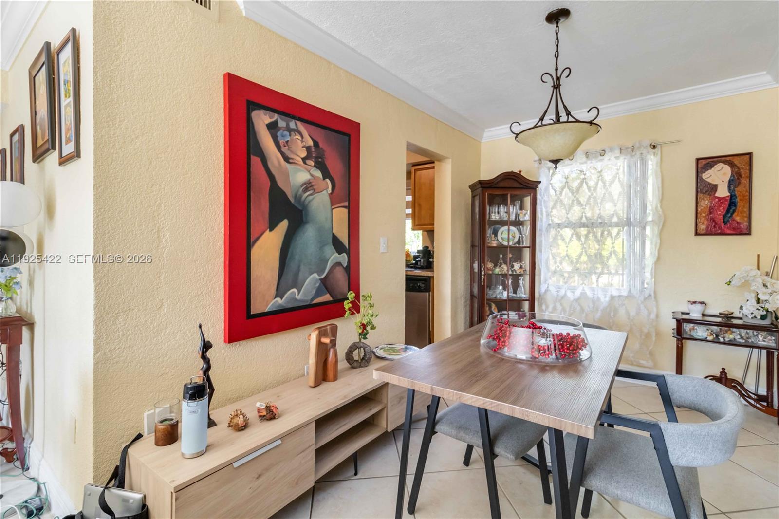 8475 Southwest 94th Street, Unit 217E Miami, FL 33156 - Photo 5 of 21 a view of a dining room with furniture window and wooden floor