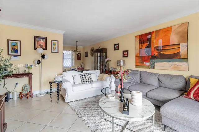 a living room with furniture and a painting