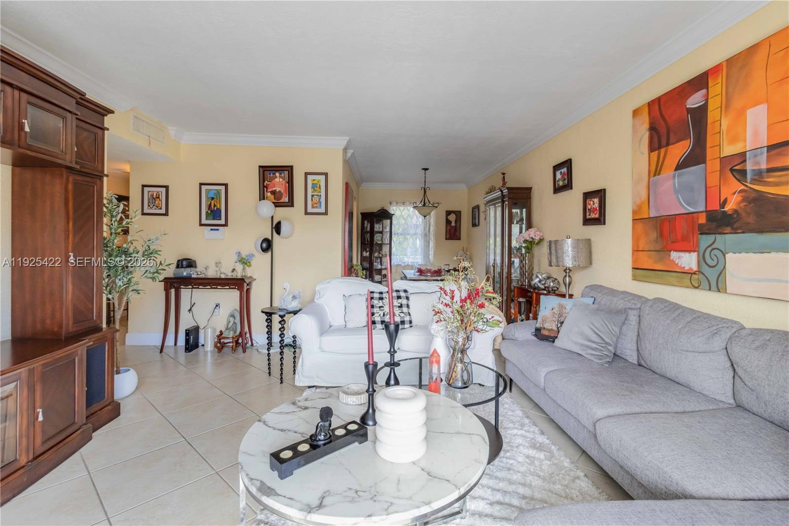 8475 Southwest 94th Street, Unit 217E Miami, FL 33156 - Photo 10 of 21 a living room with furniture and a large window
