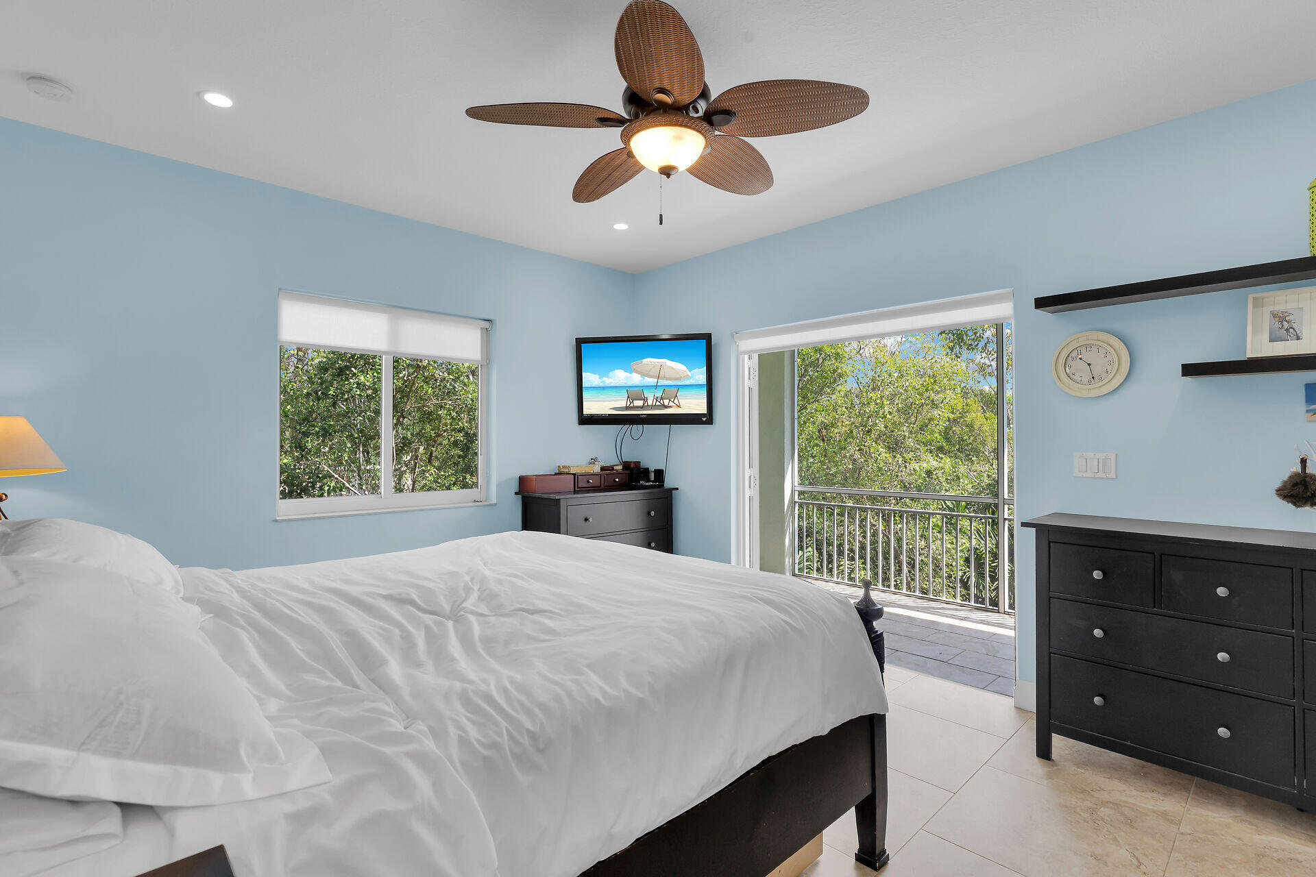 1019 Snapper Lane Key Largo, FL 33037 - Photo 18 of 49 a bedroom with a bed and a large window