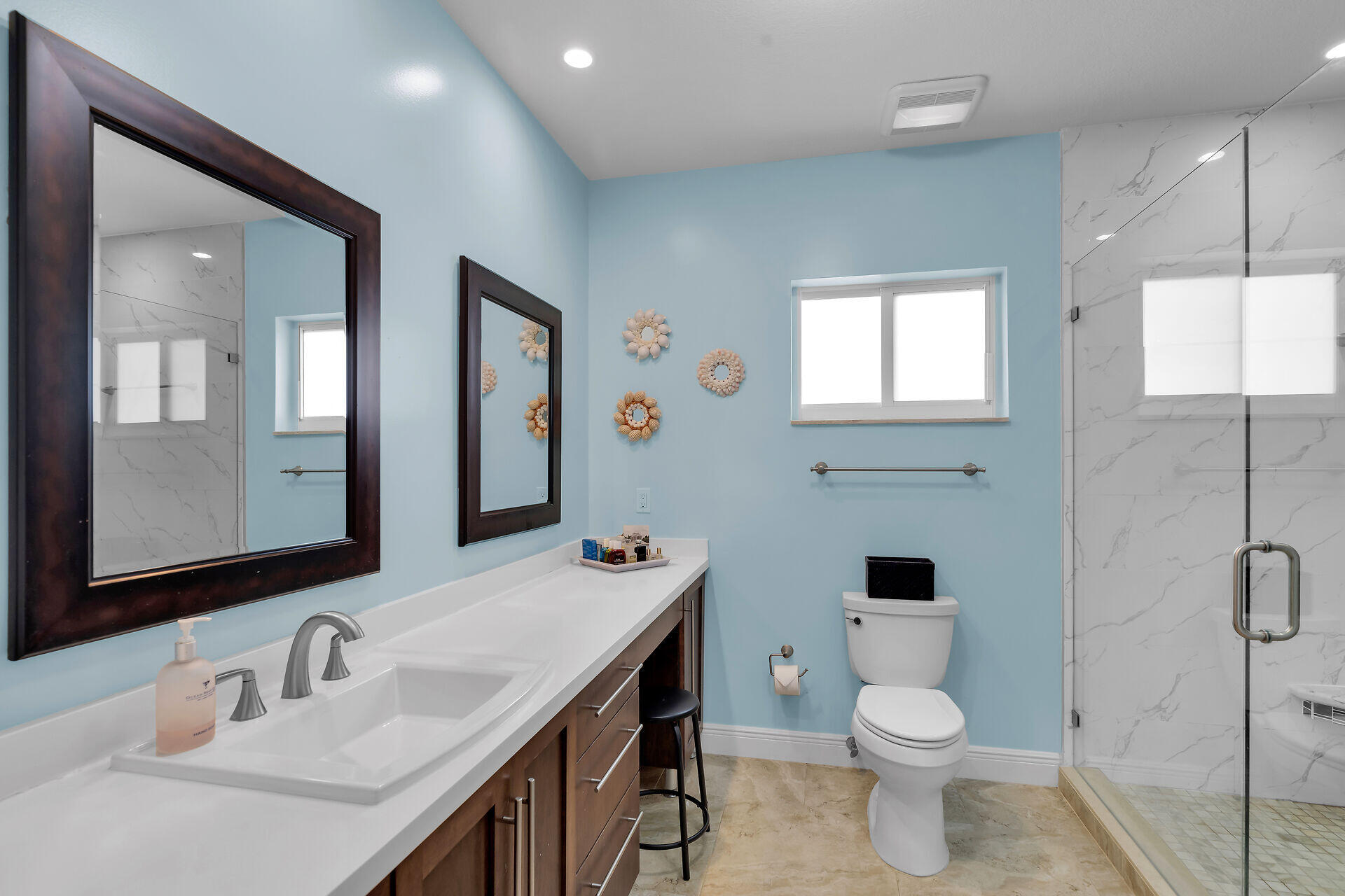 1019 Snapper Lane Key Largo, FL 33037 - Photo 20 of 49 a bathroom with a toilet a sink a mirror a window and vanity