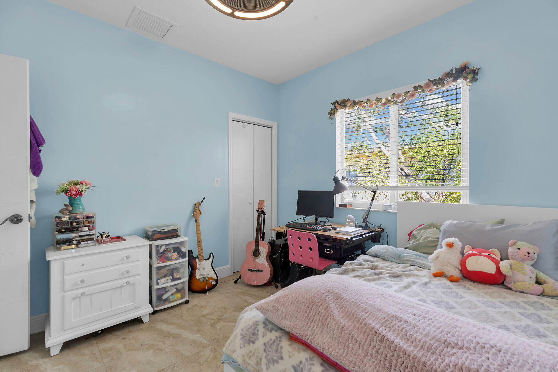 1019 Snapper Lane Key Largo, FL 33037 - Photo 24 of 49 a bedroom with a bed a dresser and a window