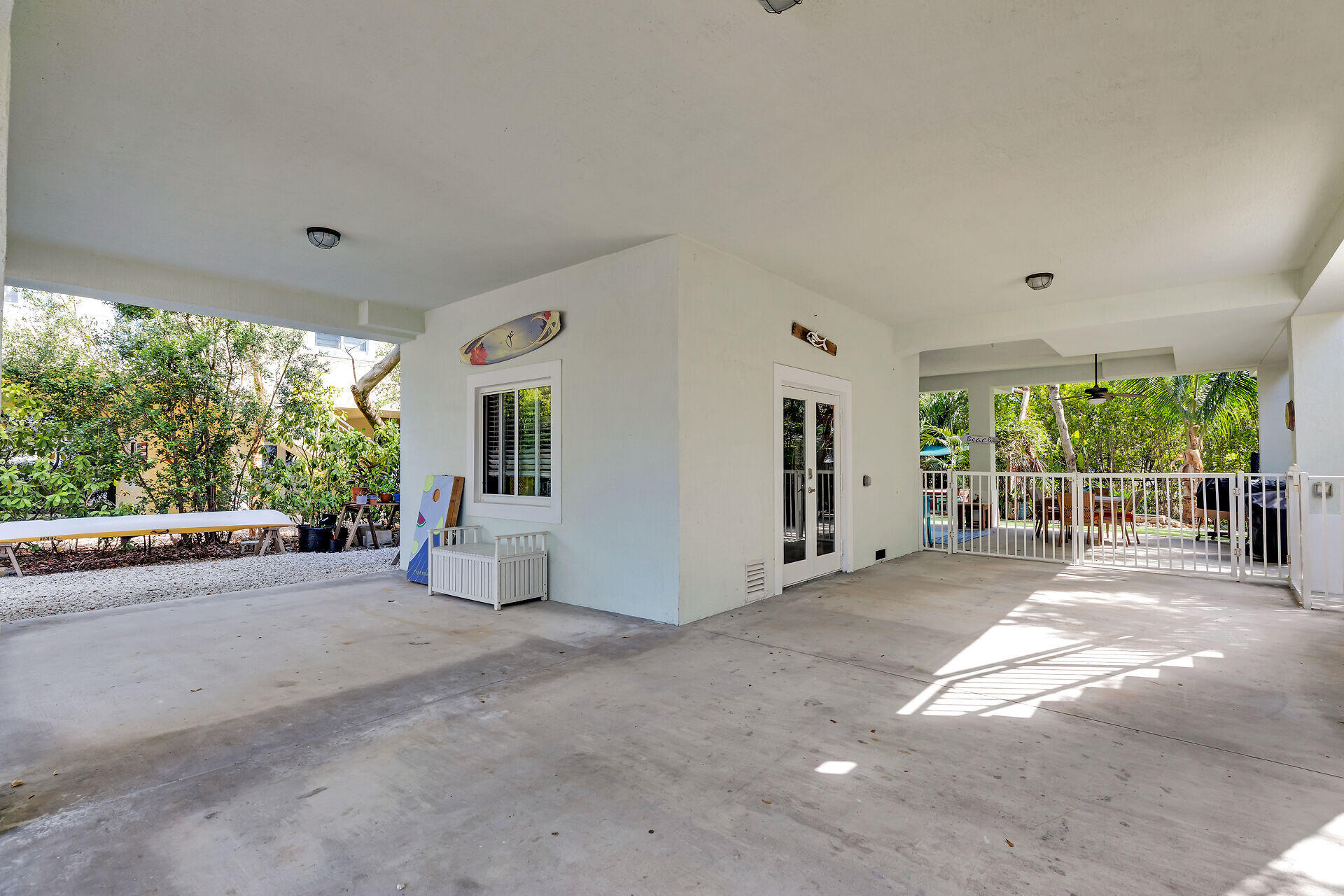 1019 Snapper Lane Key Largo, FL 33037 - Photo 4 of 49 a view of a house with porch and garden