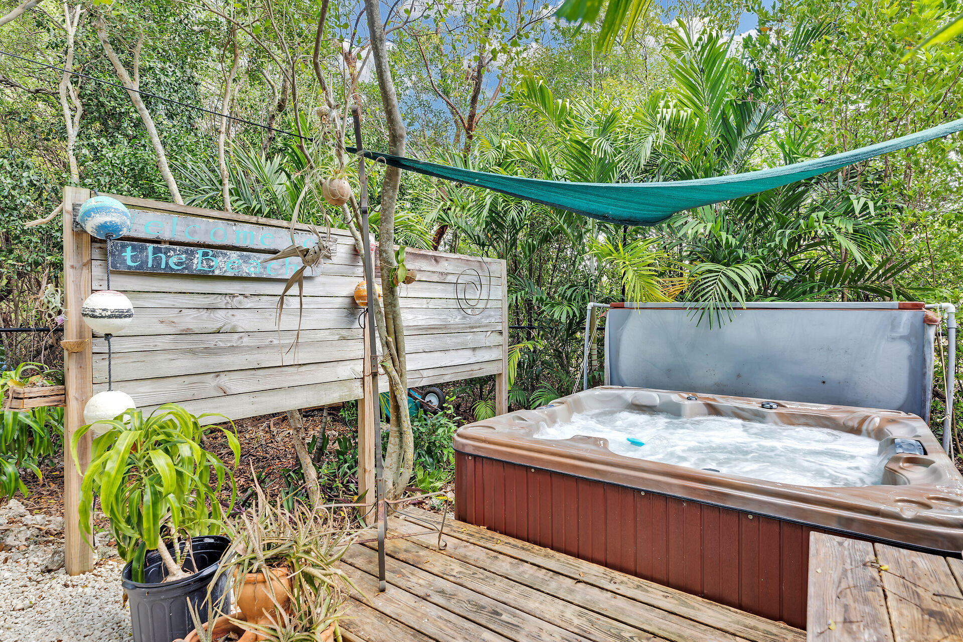 1019 Snapper Lane Key Largo, FL 33037 - Photo 42 of 49 a wooden bench sitting in front of a building