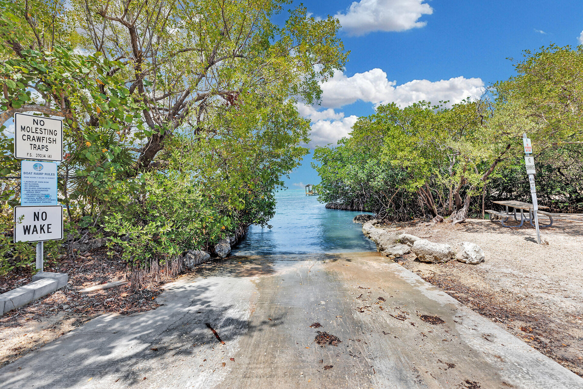 1019 Snapper Lane Key Largo, FL 33037 - Photo 47 of 49 a backyard of a house with lots of green space