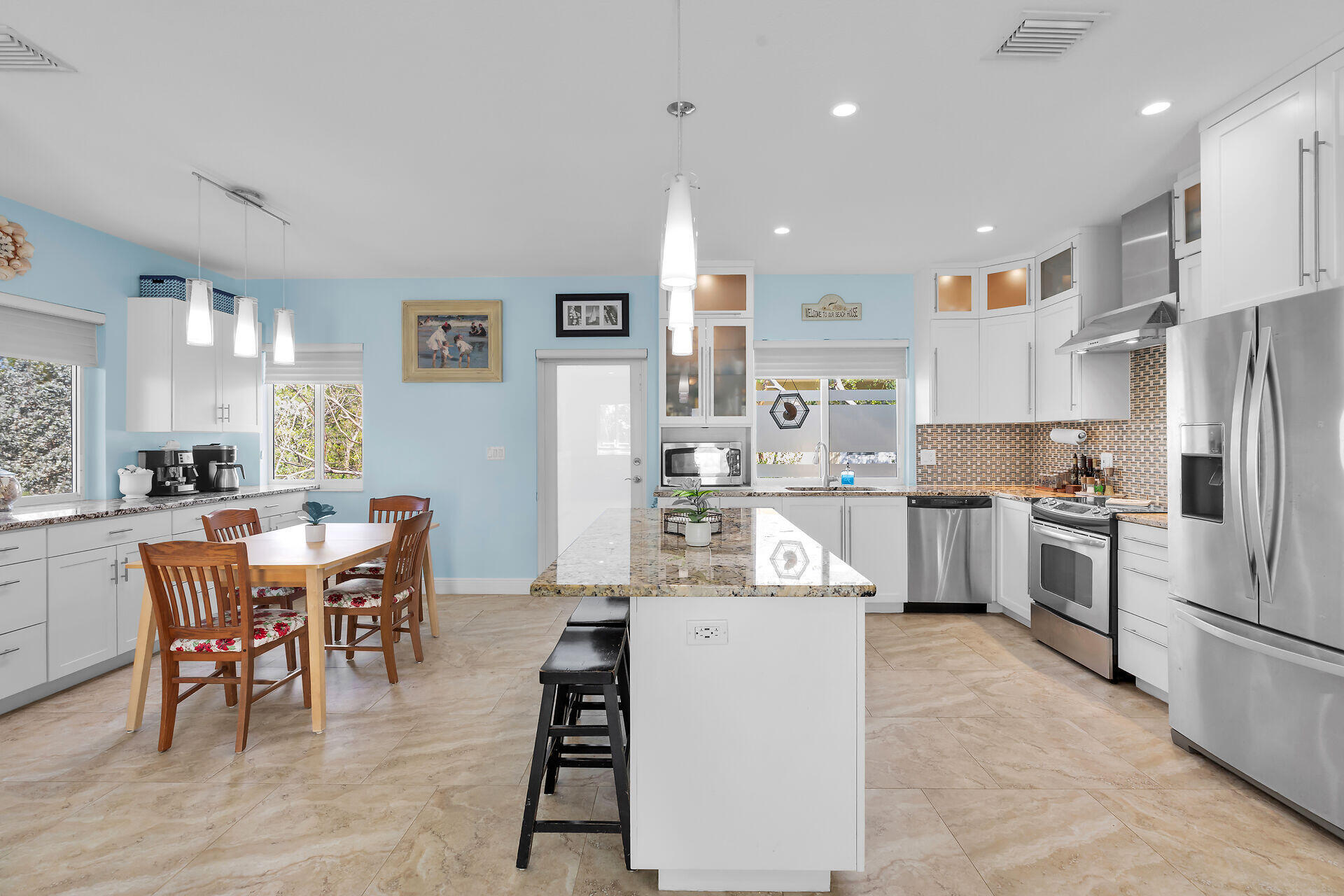 1019 Snapper Lane Key Largo, FL 33037 - Photo 8 of 49 a living room with stainless steel appliances kitchen island granite countertop furniture and a dining table with wooden floor
