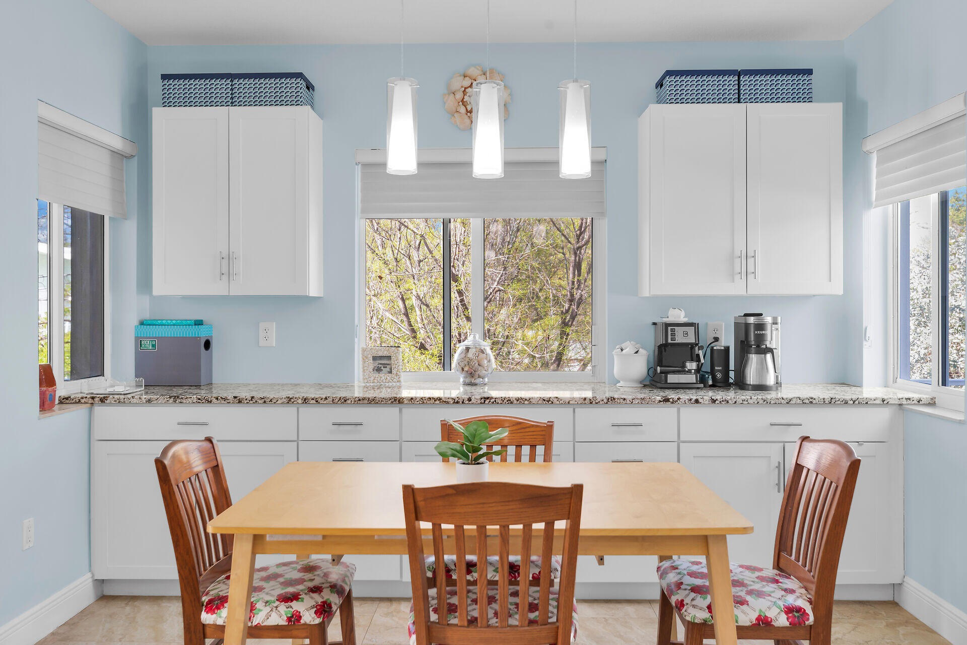 1019 Snapper Lane Key Largo, FL 33037 - Photo 10 of 49 a kitchen with stainless steel appliances granite countertop a stove top oven a refrigerator a sink and a dining table with white cabinets