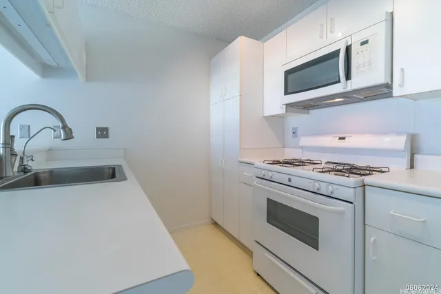 a kitchen with a stove and a microwave
