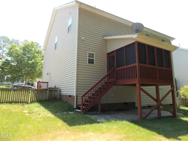 a view of a house with a backyard and stairs